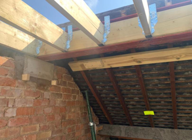 Steel beam supporting a loft conversion roof structure