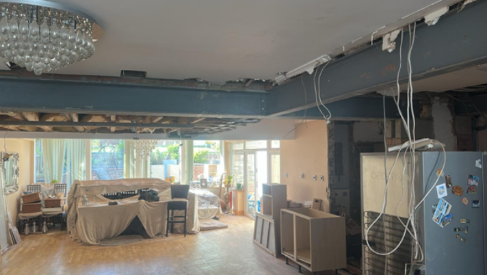 Open-plan living space created using structural steel beam installation