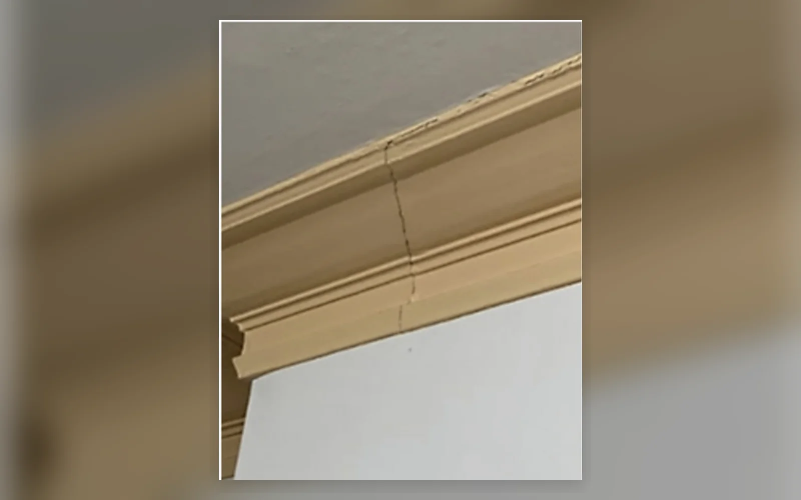Cracking through internal trim above a doorway
